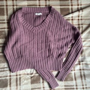 Mauve knitted sweater.